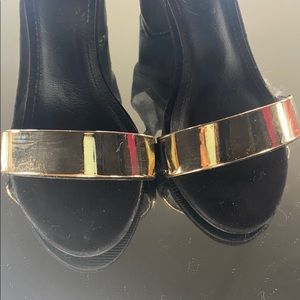 Black heels with gold decor